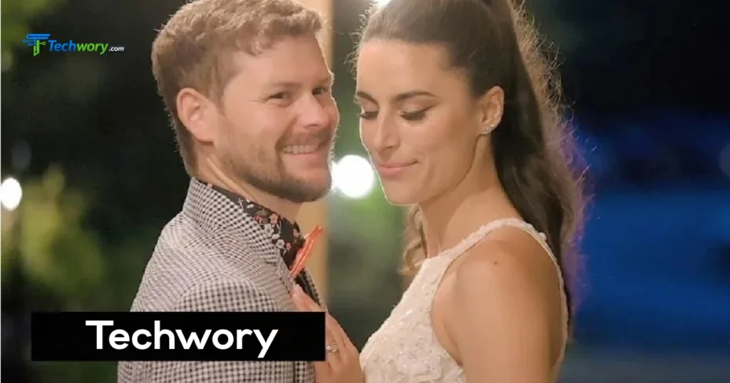 A close-up of Melanie Sergiev in a white dress sharing a tender moment with her groom.