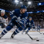 Ice hockey players battle for the puck in a packed arena during a match featured in sffarehockey statistics yesterday.